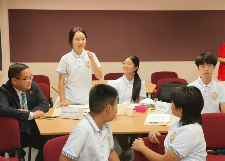 Students taking part in an APEC classroom discussion